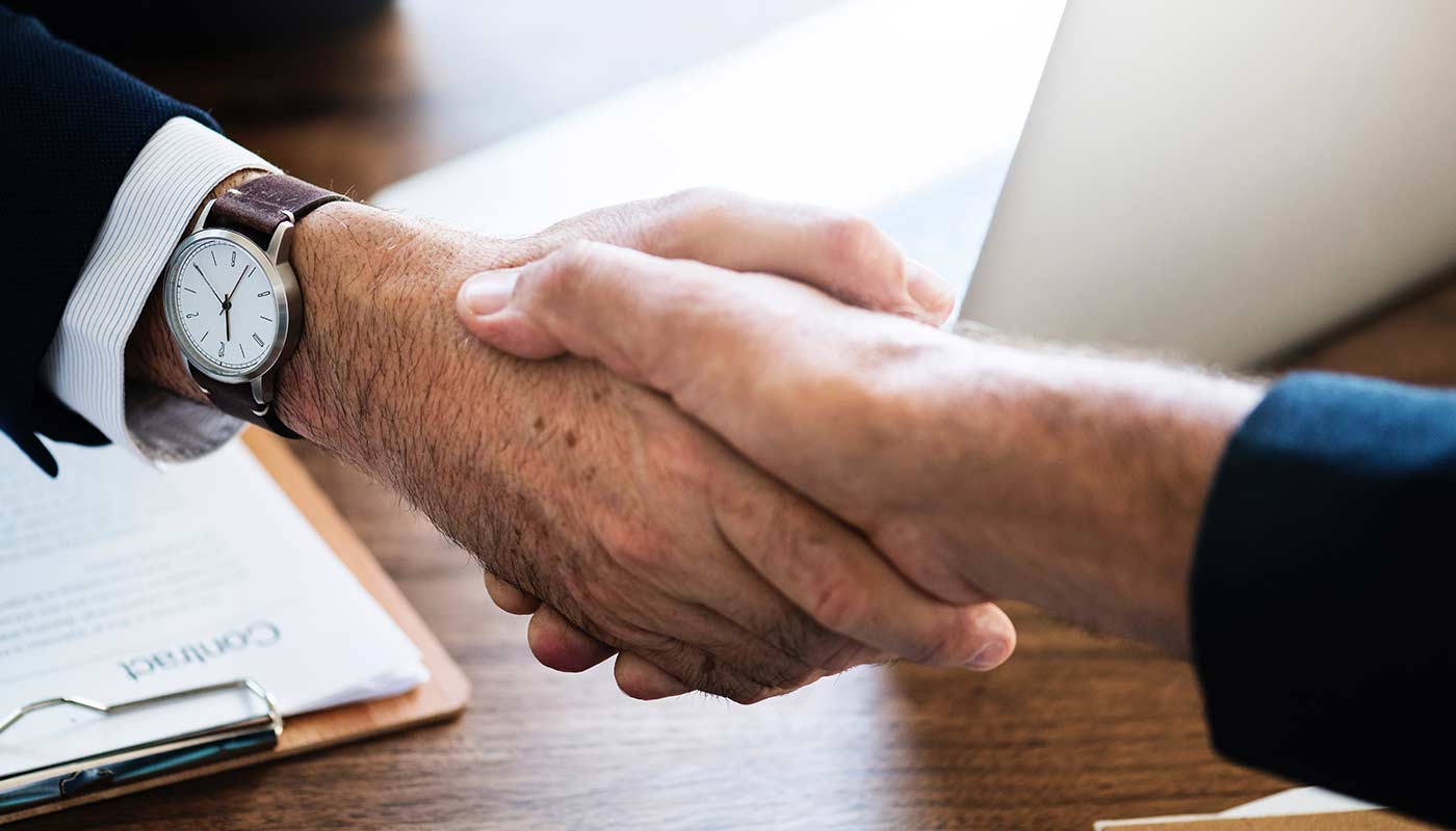 Two business men shaking hands